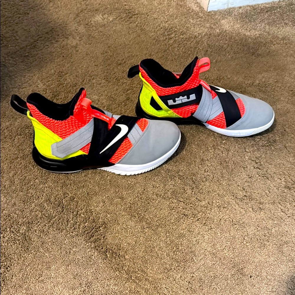 Nike Gray and Red Labron’s with Modern Design and Supportive Midsole